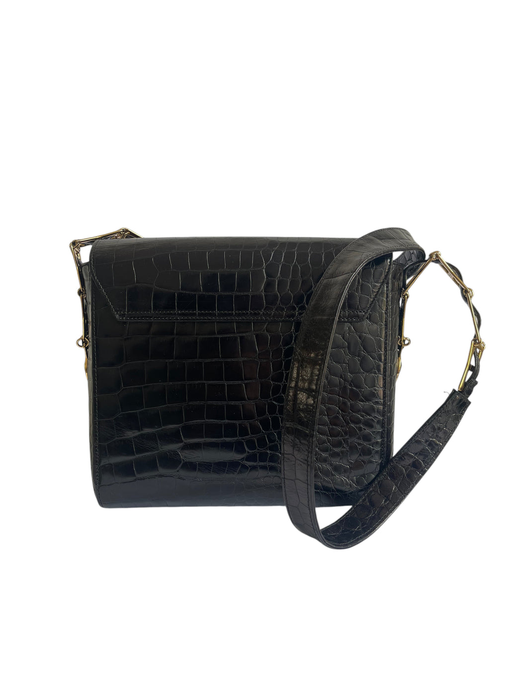Black crocodile-embossed leather crossbody bag with a wide adjustable strap and gold-tone hardware, shown against a plain white background.